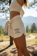 Woman wearing Motivation athletic shorts with rectangular patch design